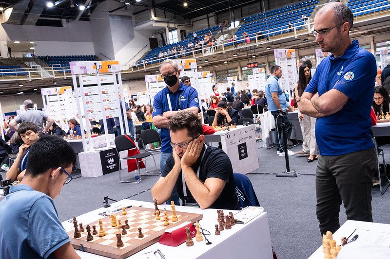 In round 2, Levon Aronian was in trouble as Leinier Dominguez and John Donalson look on.
Photo by Maria Emelianova