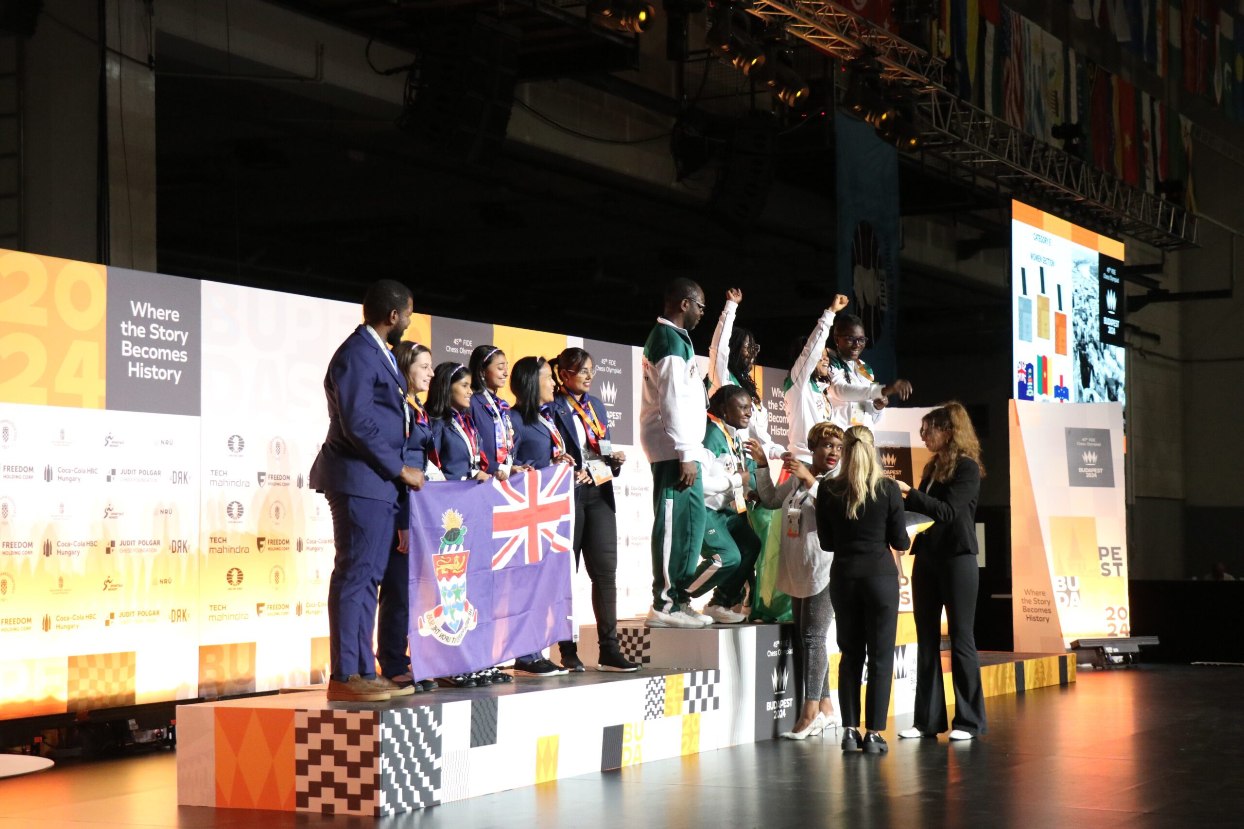 Cameroon celebrating its gold medal in Group E while Cayman Islands looks on. Photo by Daaim Shabazz.