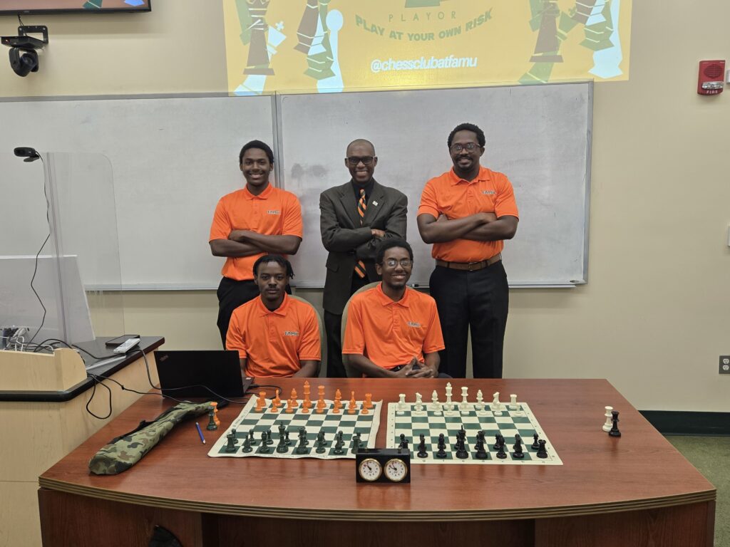 FAMU Chess Club 2024-2025 Executive Board
Seated (L-R): Toron Jones (Treasurer, Music Education), Caleb Parker (President-Computer Info. Sys.)
Standing (L-R): James Tinner (Secretary, Computer Info. Sys), Dr. Daaim Shabazz (Faculty Advisor-Business), Ricardo Stewart (Vice President-Architecture)