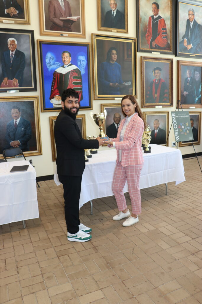 Acharya accepting 1st place trophy from Tournament Director, Tiffany Hayes
Photo by Daaim Shabazz/The Chess Drum